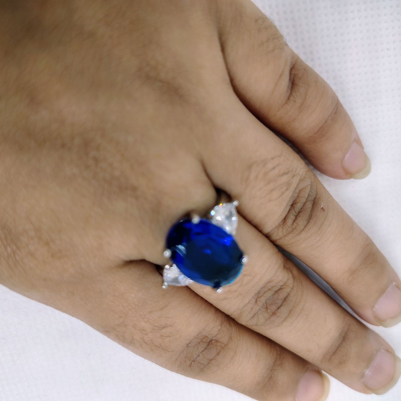 A radiant three-stone ring symbolizing past, present, and future love